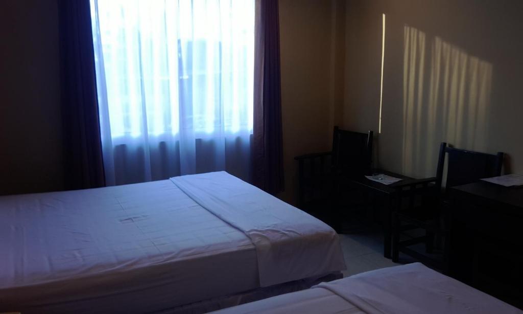 Hotel Sing A Song Pematangsiantar Szoba fotó